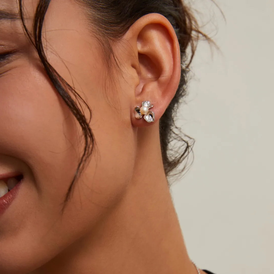S925 Silver Petal Zircon Earrings in silver worn on model with black top